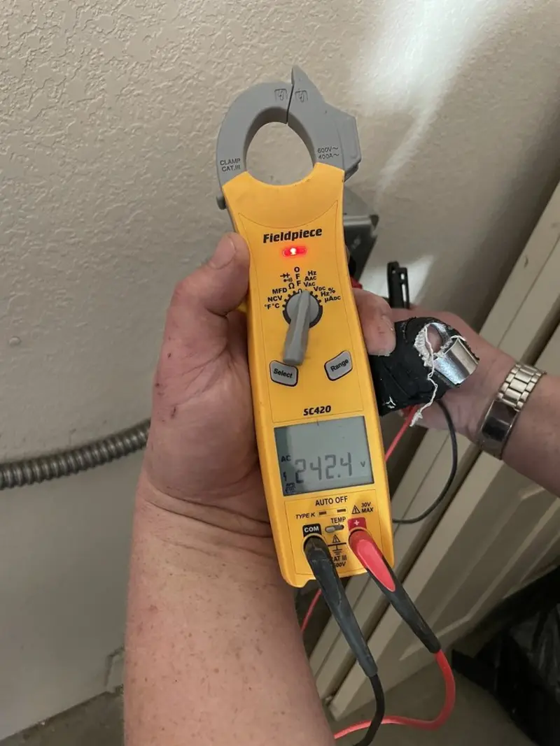 Voltage testing with clamp meter during Electrical Installation Services in Groveland